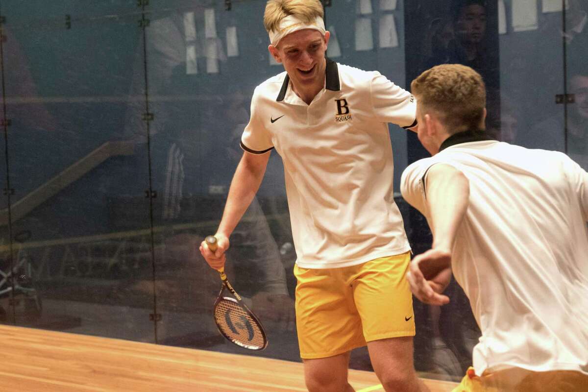 Dana Santry, left, reacts after winning the clinching match for the Brunswick School squash team in the finals of the U.S. High School Team Squash Championships at Trinity College in Hartford on Sunday, February 23, 2020.