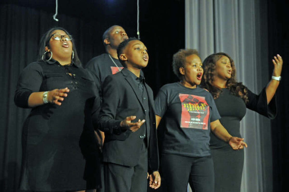 The cast of “Change to Passage” performs Sunday at Alton Middle School, including 10-year-old Landon Page, left foreground. The new musical theater piece was showcased during an African American History Month program at the school.