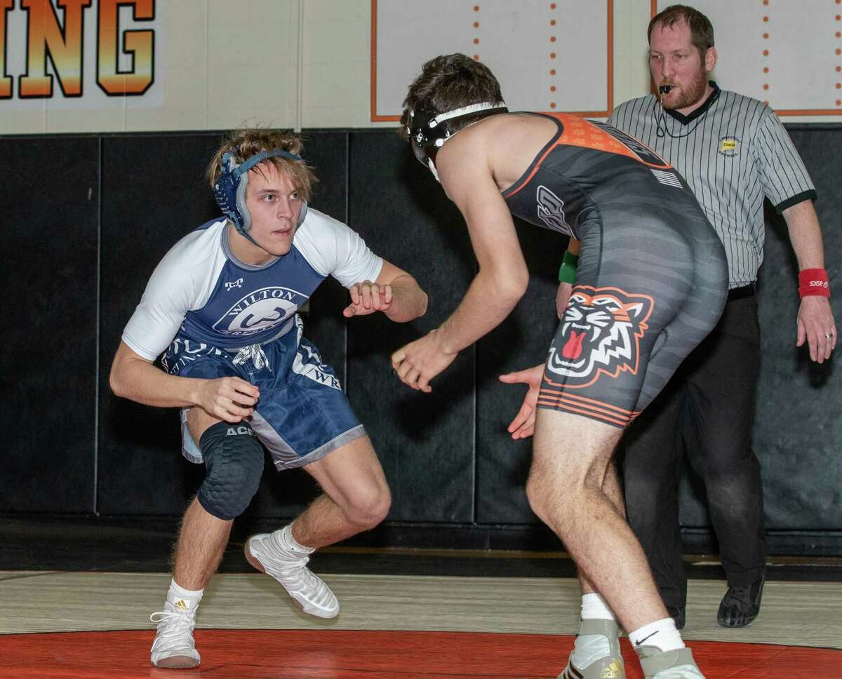 Quinton Kiss (left) was among the wrestlers who provided victories for Wilton at the Class L state tournament.