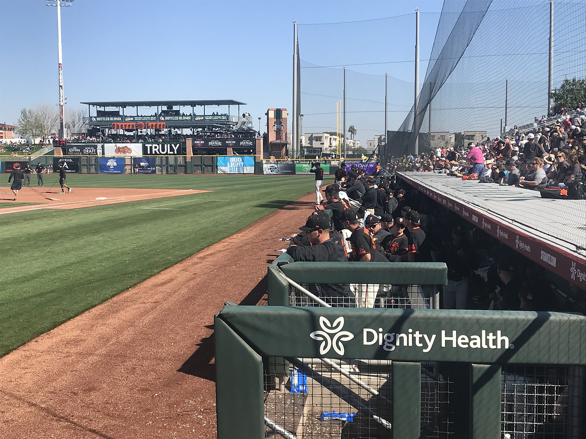 Why the Giants dugout at Scottsdale Stadium is overstuffed with players,  staff