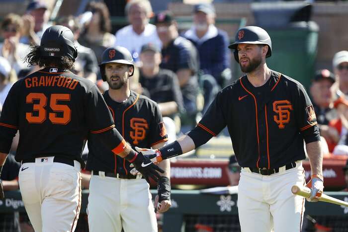 Why the Giants dugout at Scottsdale Stadium is overstuffed with players,  staff