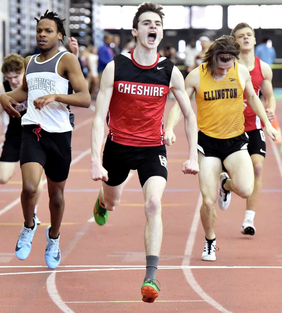 New Haven Connecticut - February 22, 2020: Ryan Farrell of Cheshire H.S., wins the the 600-meter run, center, as Talib McBride of Hillhouse H.S. places second, left, and Jack Olender of Ellington H.S. places third during the CIAC State Open Indoor Track Championship Saturday at the Floyd Little Athletic Center in New Haven.
