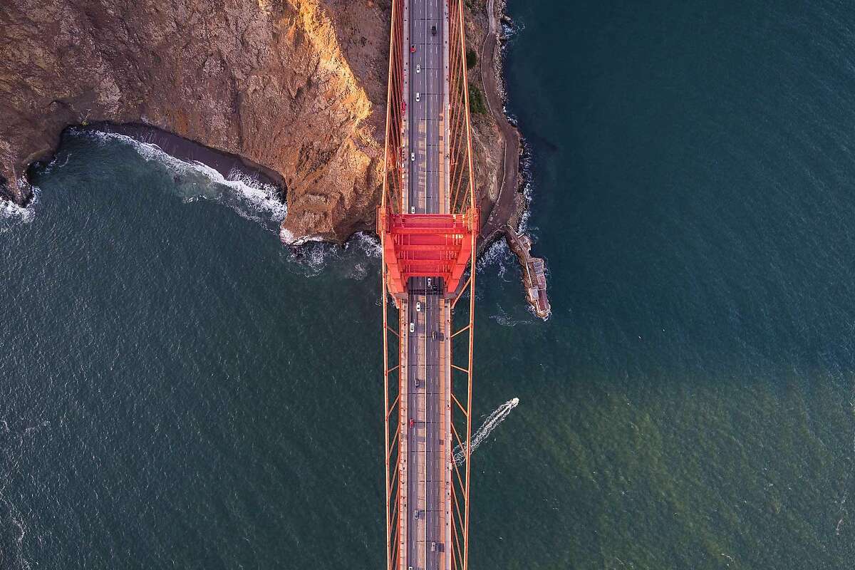 An aerial photo taken legally from a helicopter of the Golden Gate Bridge. Numerous drones have taken illegal photos from a similar angle.
