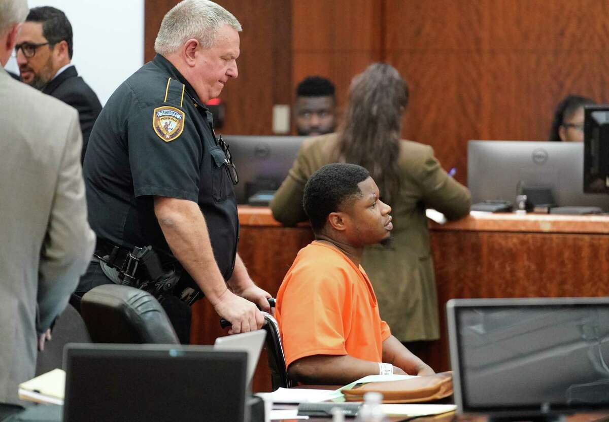 Gregory Allen Smith is escorted into the 208th Criminal District Court for an appearance Tuesday, Feb. 24, 2020 in Houston. He is charged with three counts of intoxication manslaughter for a crash that killed three people on Feb. 5.