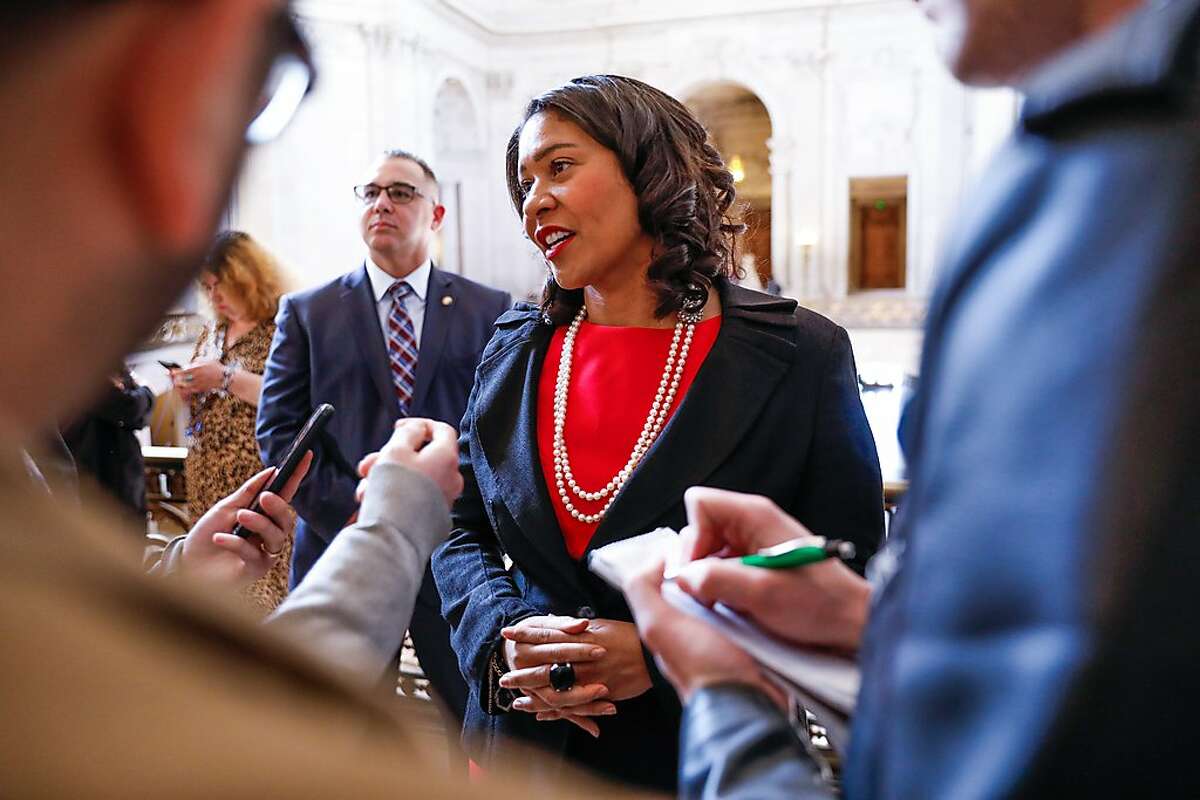 Mayor London Breed (center) answers questions from journalists after a press conference regarding gay pride at City Hall on Tuesday, Feb. 18, 2020 in San Francisco, California.