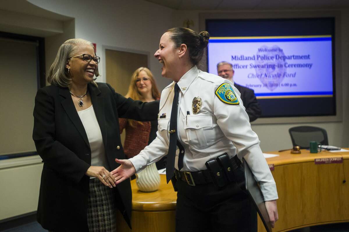 City of Midland Police Chief Nicole Ford chats with City Councilwoman Diane Brown Wilhelm after a swearing-in ceremony for Ford Monday, Feb. 24, 2020 at City Hall. Ford is the first woman to serve as Police Chief in Midland. (Katy Kildee/kkildee@mdn.net)