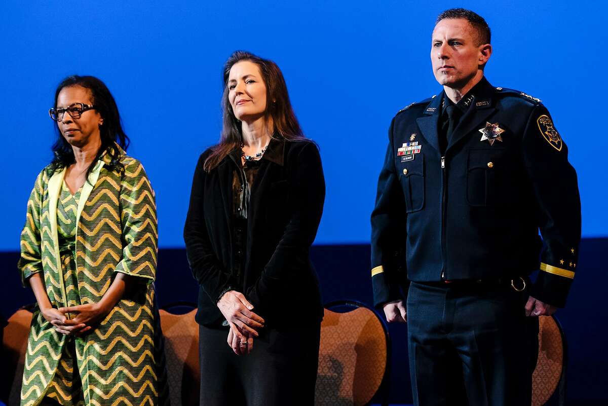 Acting Oakland Police Chief Darren Allison, right, Oakland Mayor Libby Schaaf, and Oakland Police Commission chair Regina Jackson stand on stage during the Oakland Police Department's 183rd Basic Recruit Academy Graduation held at the Scottish Rite Center in Oakland, California, on Friday, Feb. 21, 2020. The Oakland Police Commission voted unanimously in a closed session on Thursday to fire Police Chief Anne Kirkpatrick.
