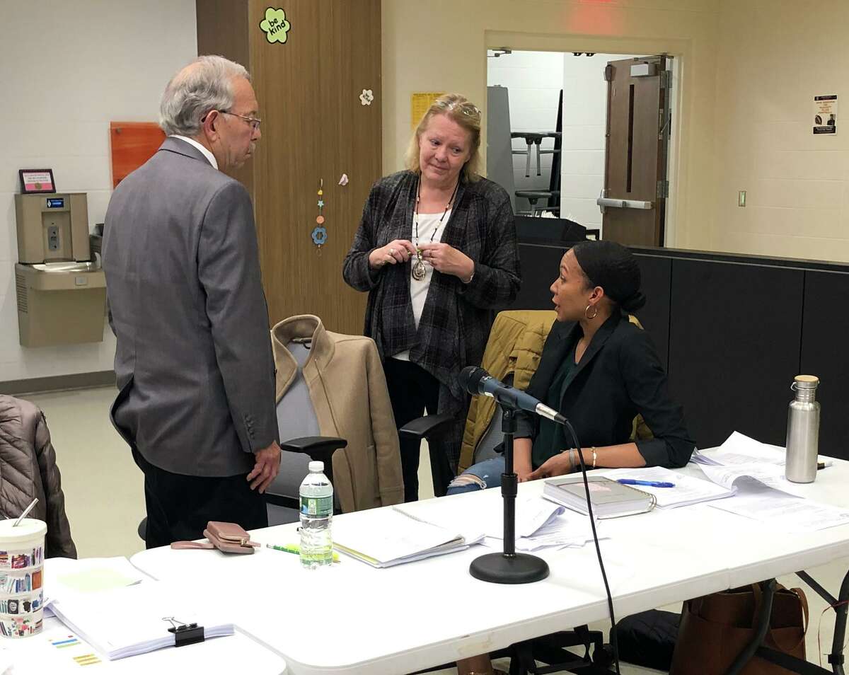 From left, Stratford Board of Education members Vinny Faggella, Karen Rodia and Janice Cupee talk during a recess at a Feb. 24, 2020 school board meeting.