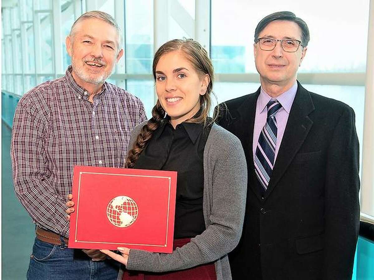 SIUE Study Abroad Advisor Kim Browning, left, stands next to Peace Corps Prep certificate recipient Dana Sigman, a School of Engineering alumna, and SOE Dean Cem Karacal.