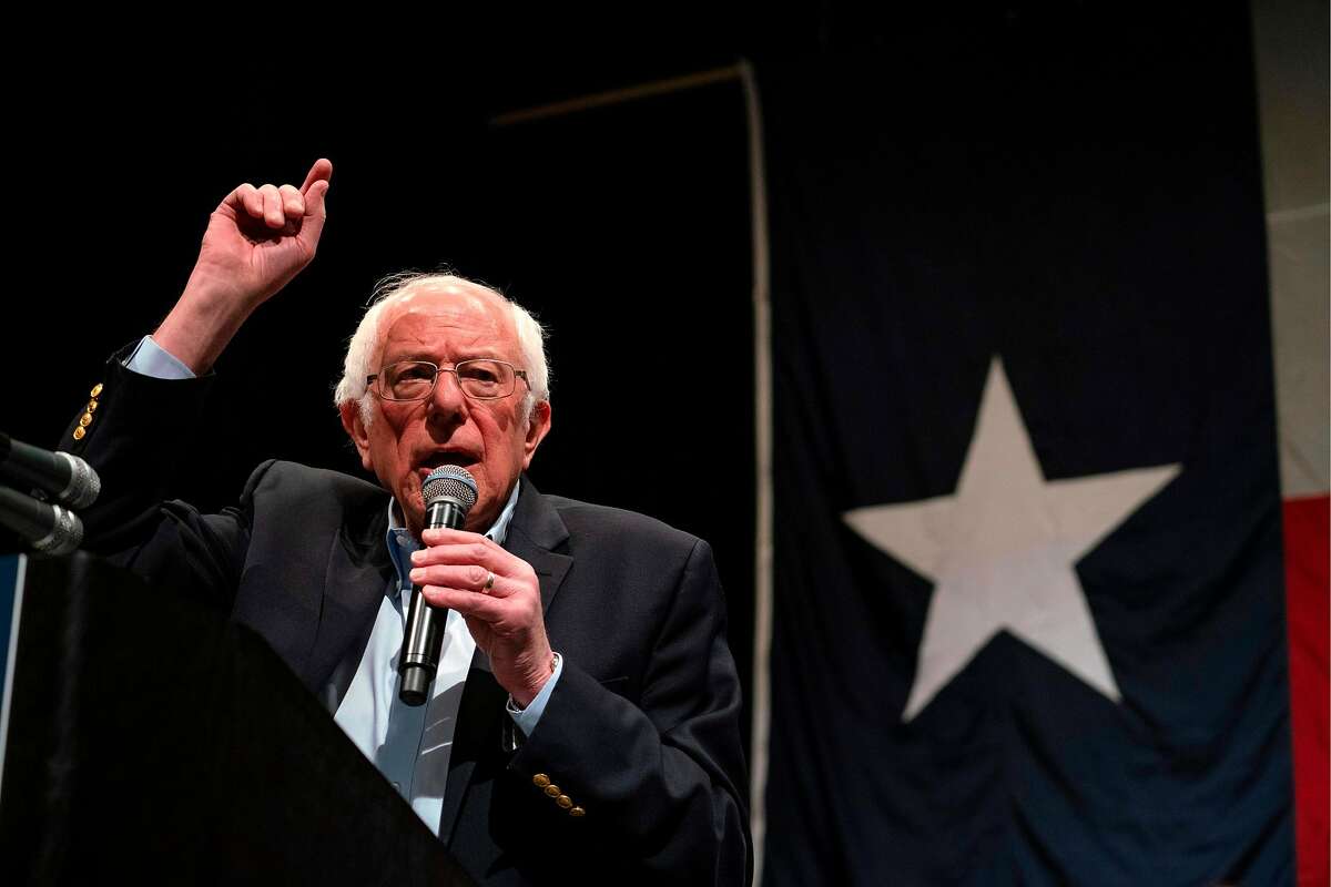 (FILES) In this file photo taken on February 22, 2020 Democratic presidential hopeful Vermont Senator Bernie Sanders gestures as he speaks during a rally at the Abraham Chavez Theater in El Paso, Texas. - Bernie Sanders' past praise of communist regimes like Cuba and the Soviet Union has come back to haunt him, his rivals for the Democratic White House nomination seeking to paint the frontrunner as a friend of left-wing dictators. Fellow Democratic hopefuls Joe Biden, Michael Bloomberg and Pete Buttigieg all seized on visits Sanders made to the USSR, the Sandinista-controlled Nicaragua and Fidel Castro's Cuba in the 1980s as evidence he is a threat to the US democratic and capitalist system. (Photo by Paul Ratje / AFP) (Photo by PAUL RATJE/AFP via Getty Images)