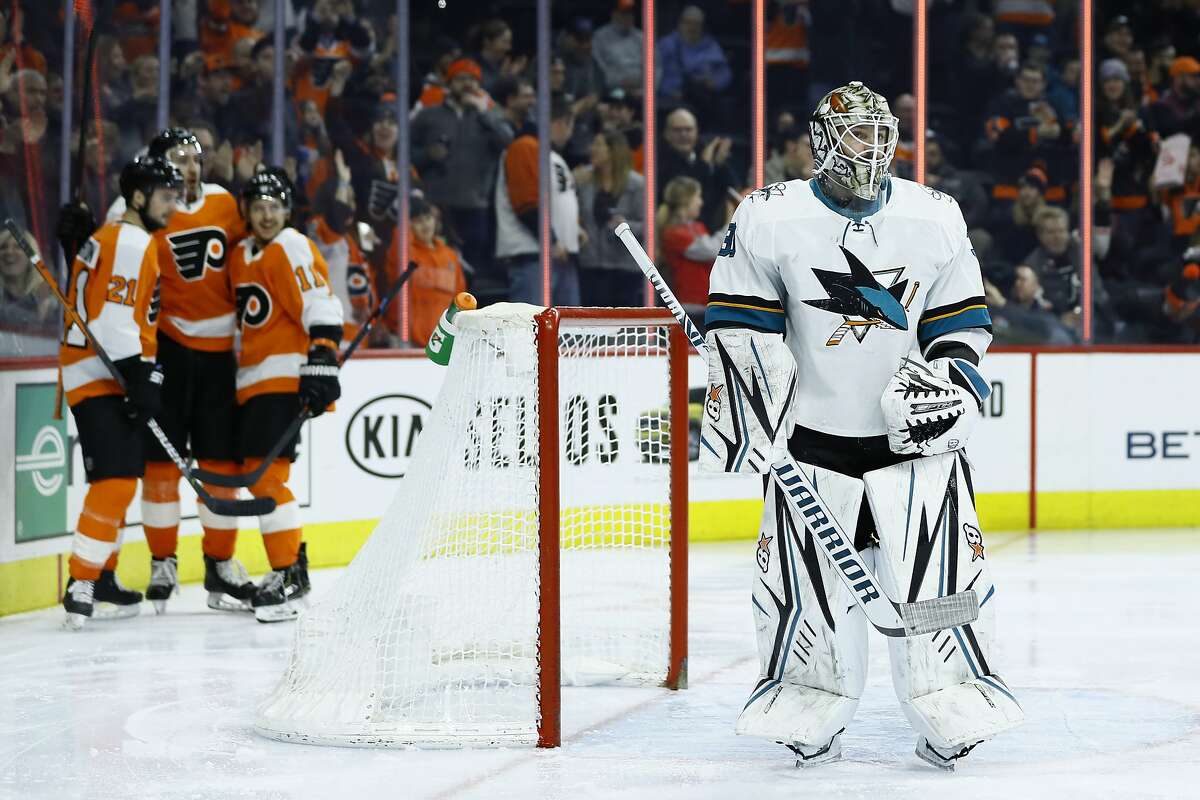 San Jose Sharks' Aaron Dell, right, reacts after giving up a goal to Philadelphia Flyers' Kevin Hayes during the second period of an NHL hockey game, Tuesday, Feb. 25, 2020, in Philadelphia. (AP Photo/Matt Slocum)