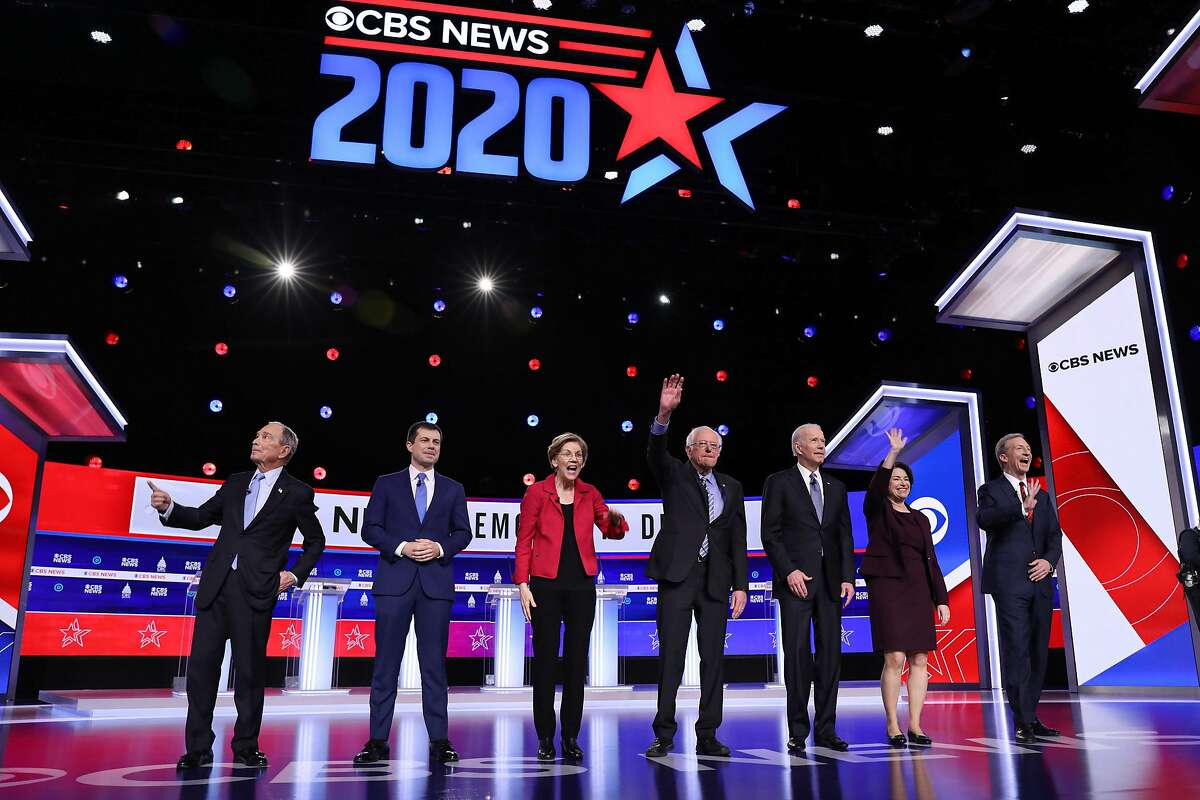 (L-R) Democratic presidential hopefuls Former New York Mayor Mike Bloomberg, Former mayor of South Bend, Indiana, Pete Buttigieg, Massachusetts Senator Elizabeth Warren, Vermont Senator Bernie Sanders, Former Vice President Joe Biden, Indiana Senator Amy Klobuchar and Billionaire activist Tom Steyer arrive to participate in the tenth Democratic primary debate of the 2020 presidential campaign season co-hosted by CBS News and the Congressional Black Caucus Institute at the Gaillard Center in Charleston, South Carolina, on February 25, 2020. (Photo by Logan CYRUS / AFP) (Photo by LOGAN CYRUS/AFP via Getty Images)