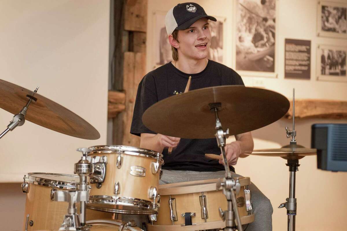 Mattias Onnerud of the Wilton High School jazz band played the drums at the Wilton Historical Society earlier this year. Next fall, the high school will offer a new music course for students who play percussion instruments.