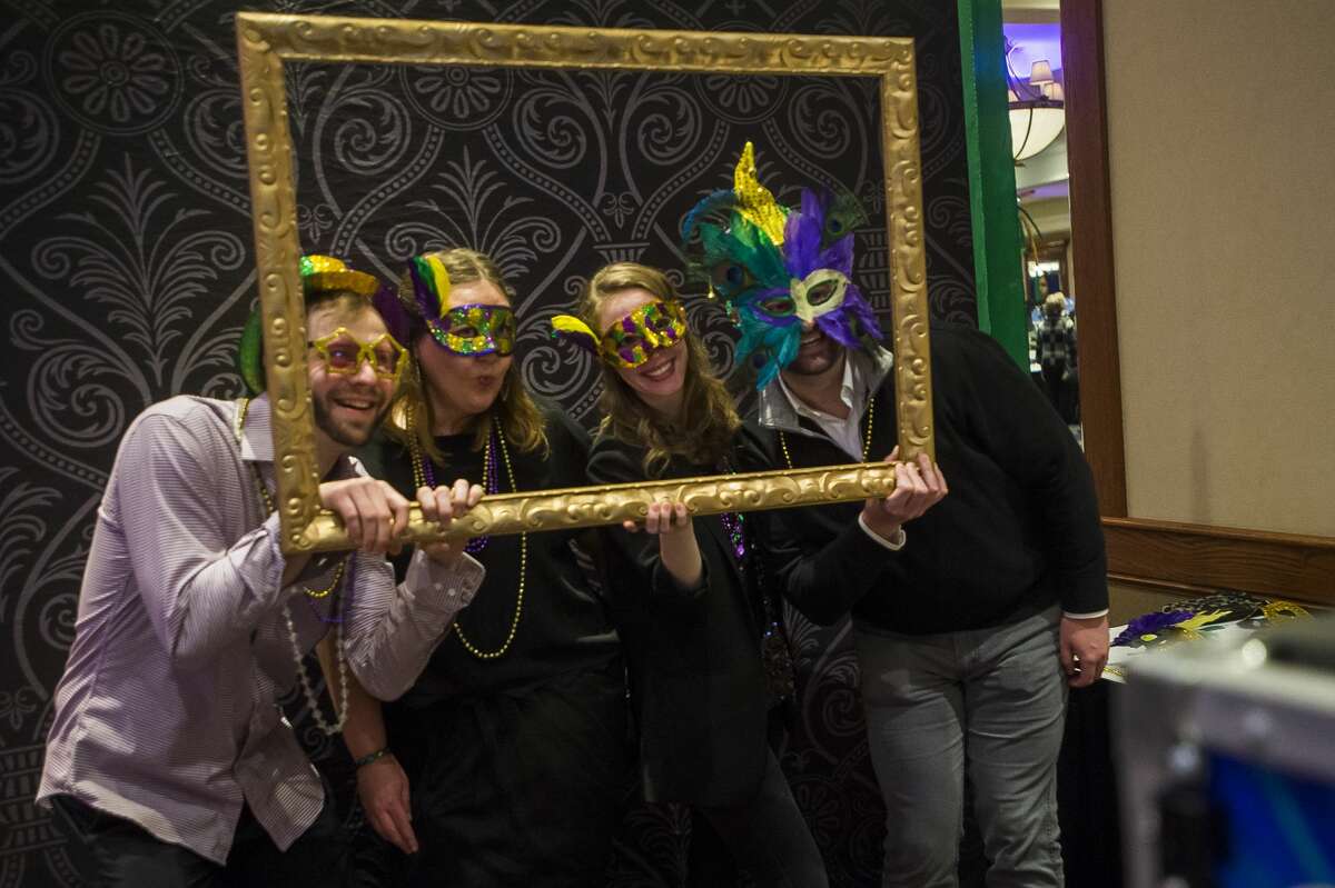 Guests attend The Legacy Center's annual Mardi Gras Feast Tuesday, Feb. 25, 2020 at the Great Hall Banquet & Convention Center. (Katy Kildee/kkildee@mdn.net)