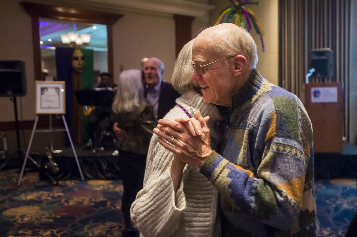 Duane Townley dances with Terry Townley during The Legacy Center's annual Mardi Gras Feast Tuesday, Feb. 25, 2020 at the Great Hall Banquet & Convention Center. (Katy Kildee/kkildee@mdn.net)