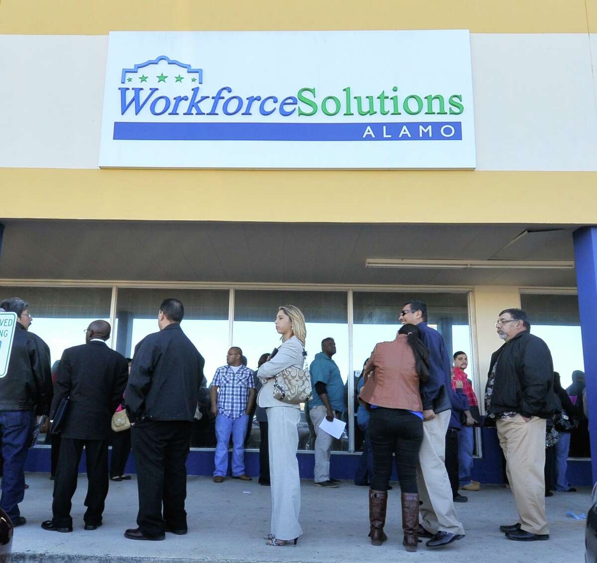 Job seekers wait in line to attend the Workforce Solutions Alamo job fair in 2014.