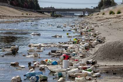 Large amounts of trash and plastic refuse collect in Ballona Creek in Los Angeles County after a rainstorm.