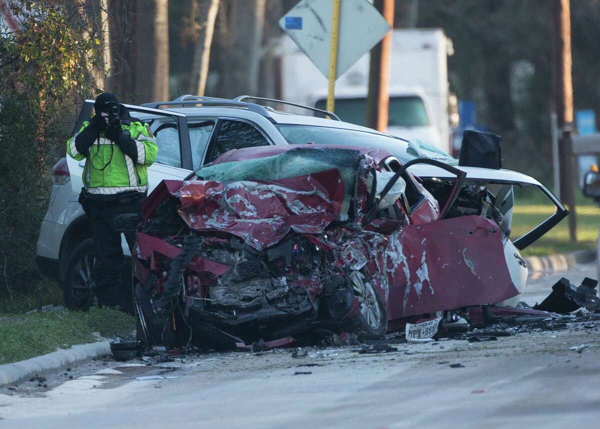 Harris County Sheriff's Office authorities investigate a fatal crash near the intersection of Old Humble and Bender roads on Feb. 14, 2020, in Humble. Drivers of both vehicles involved in the crash died.
