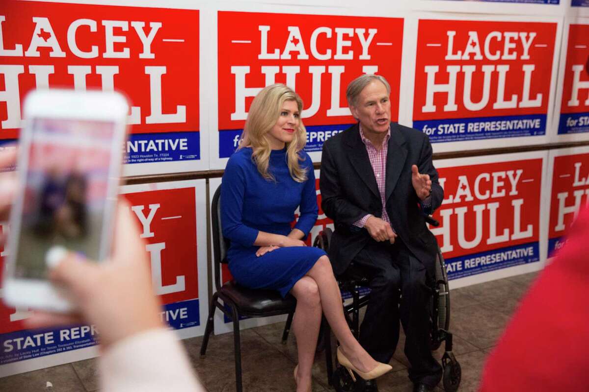 Texas Gov. Greg Abbott records a supporting video with Lacey Hull, candidate for State Representative in House District 138, during a campaign event Monday, Feb. 24, 2020, at Fratelli's Ristorante in Houston. The governor endorsed Hull on February 11, 2020.