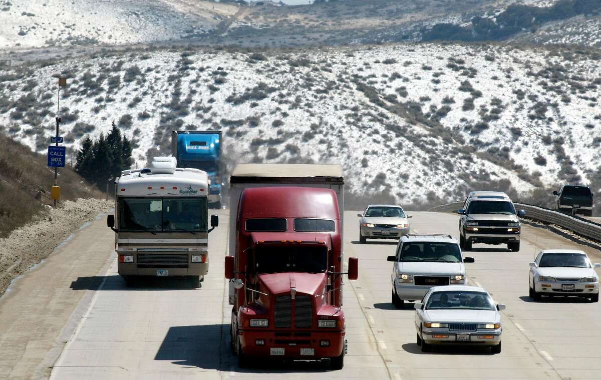 Traffic resumed back to normal in both directions of the I-5 grapevine section near Frazier Park, Calif., Monday, March 18, 2002, after the road was closed Sunday night because of snow. (AP Photo/The Bakersfield Californian, Dan Ocampo) Ran on: 01-03-2006 Ran on: 01-03-2006
