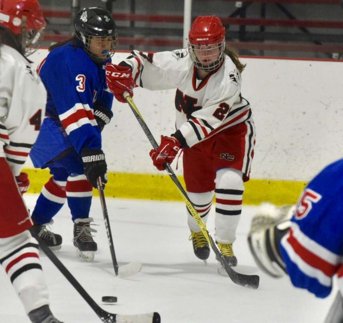 New Canaan’s Maddie Kloud (27) sends a pass to a teammate during the Rams’ game against Fairfield in the FCIAC girls ice hockey semifinals at the Darien Ice House on Wednesday, Feb. 26, 2020.
