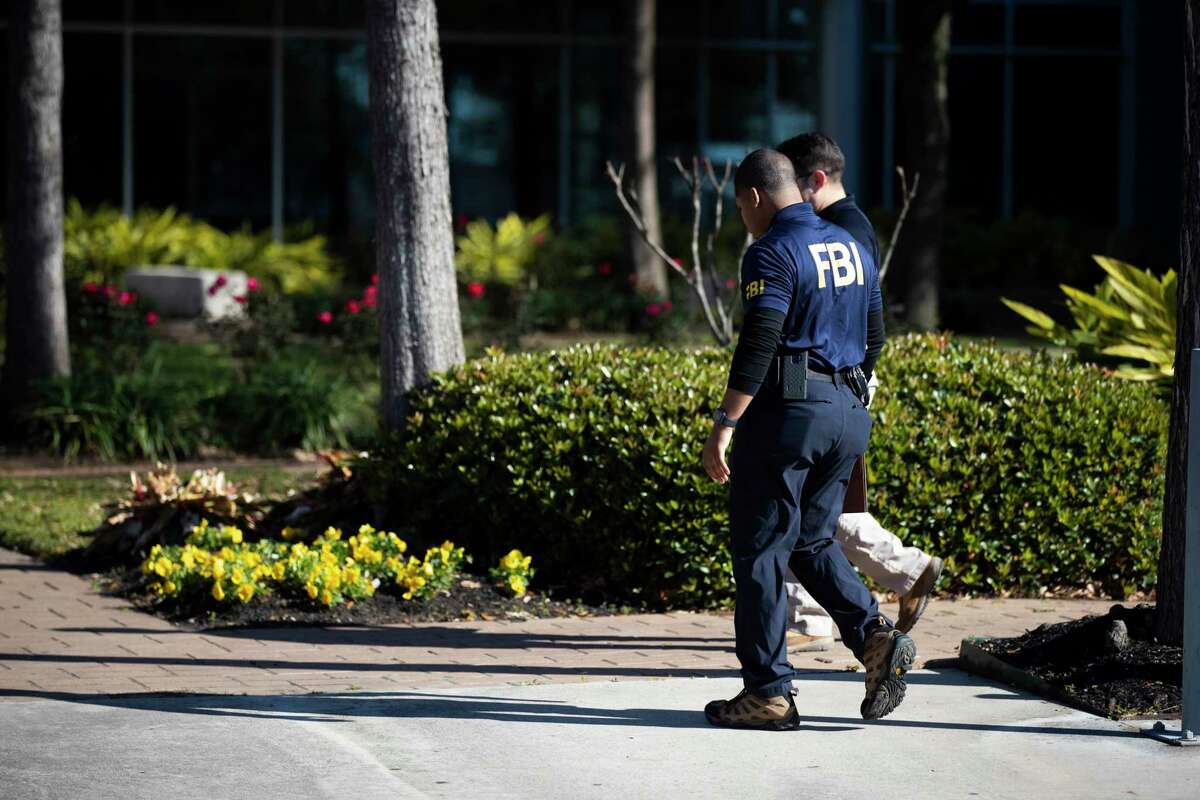 A man wearing an FBI shirt enters the Hattie Mae White, HISD Administration Building on Thursday, Feb. 27, 2020.