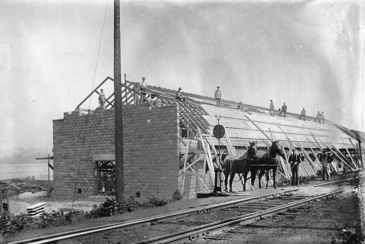 Apple storage shed being built in Elberta by the Berryhill family, later to become the site of the Elberta Packing Co. with the tall smokestack. (Courtesy Photo)