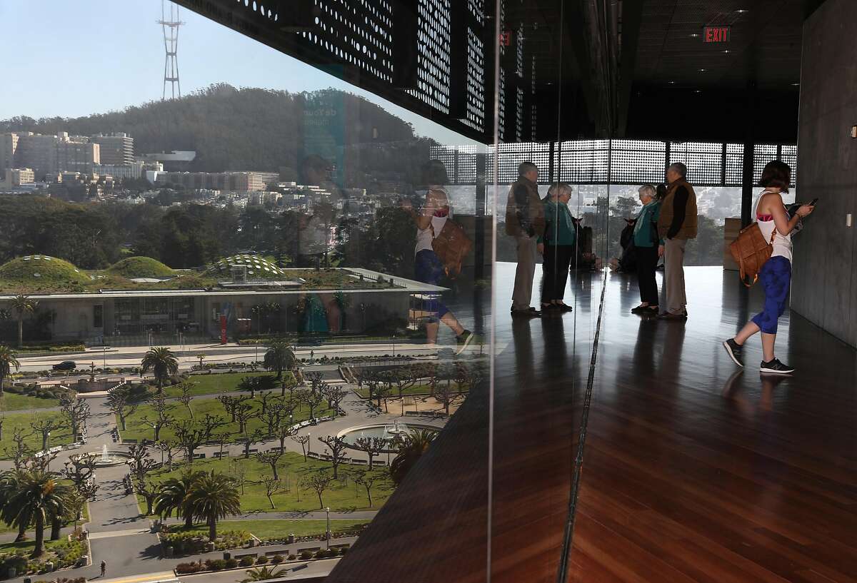 Visitors seen on the observation tower at the De Young museum on Wednesday, Feb. 26, 2020, in San Francisco, Calif.