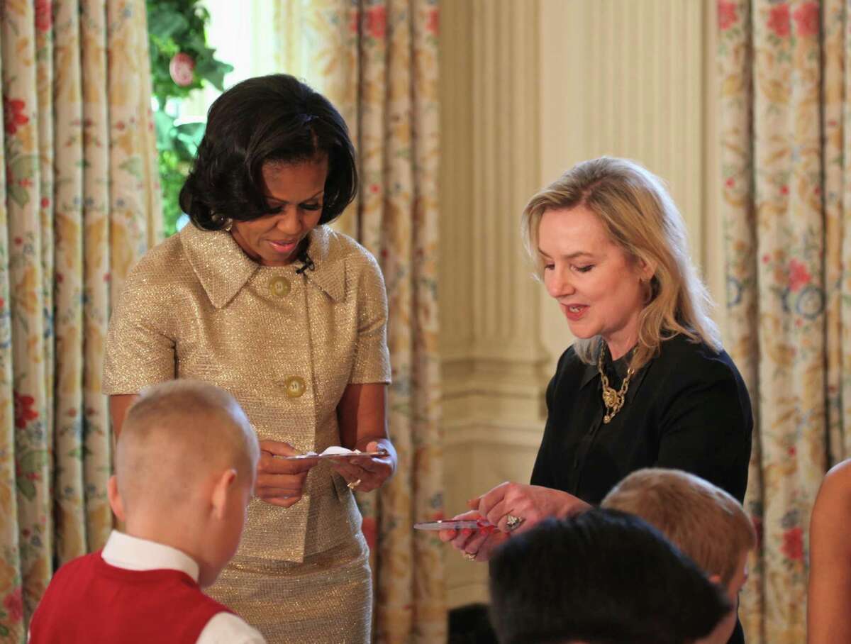 Laura Dowling is shown with former first lady Michelle Obama. Dowling was the official White House florist for six years during the Obama administration.