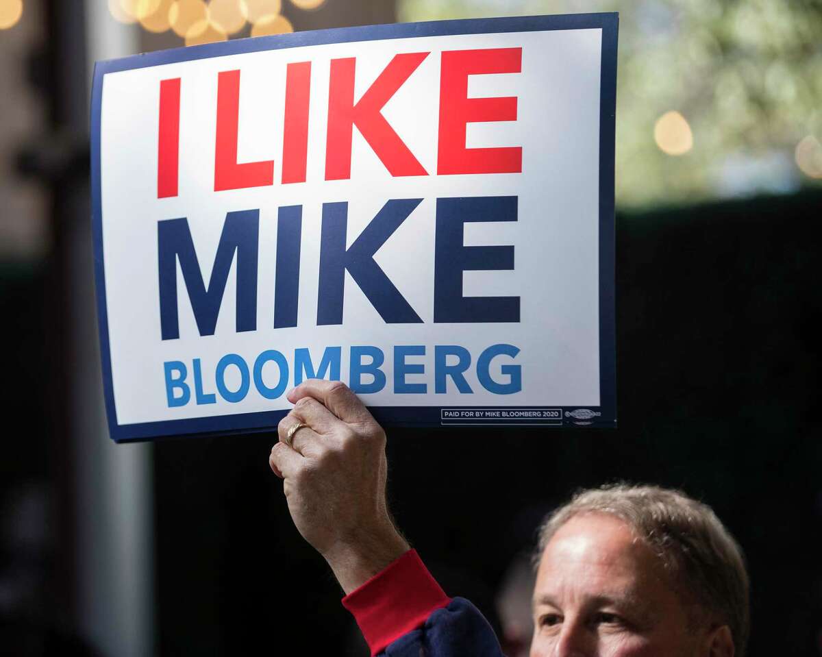 Supporters cheer Democratic presidential hopeful Michael Bloomberg as he speaks during a campaign stop, Thursday, Feb. 27, 2020 in Houston.