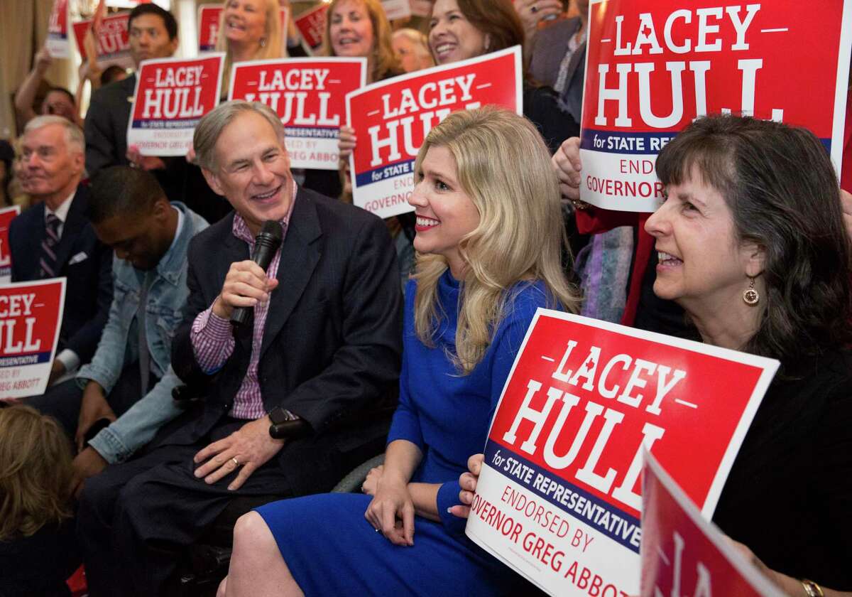 Texas Gov. Greg Abbott records a video with Lacey Hull, right, candidate for State Representative in House District 138, and her supporters during a campaign event Monday, Feb. 24, 2020, at Fratelli's Ristorante in Houston. The governor endorsed Hull on February 11, 2020.