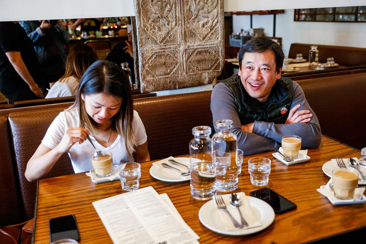 Desmond Tan (right), the owner of Burma Superstar laughs during an interview at Burma Superstar in Oakland, California, on Thursday, Feb. 20, 2020.Tan�s newest restaurant Burma Bites will be focused on to-go and delivery.