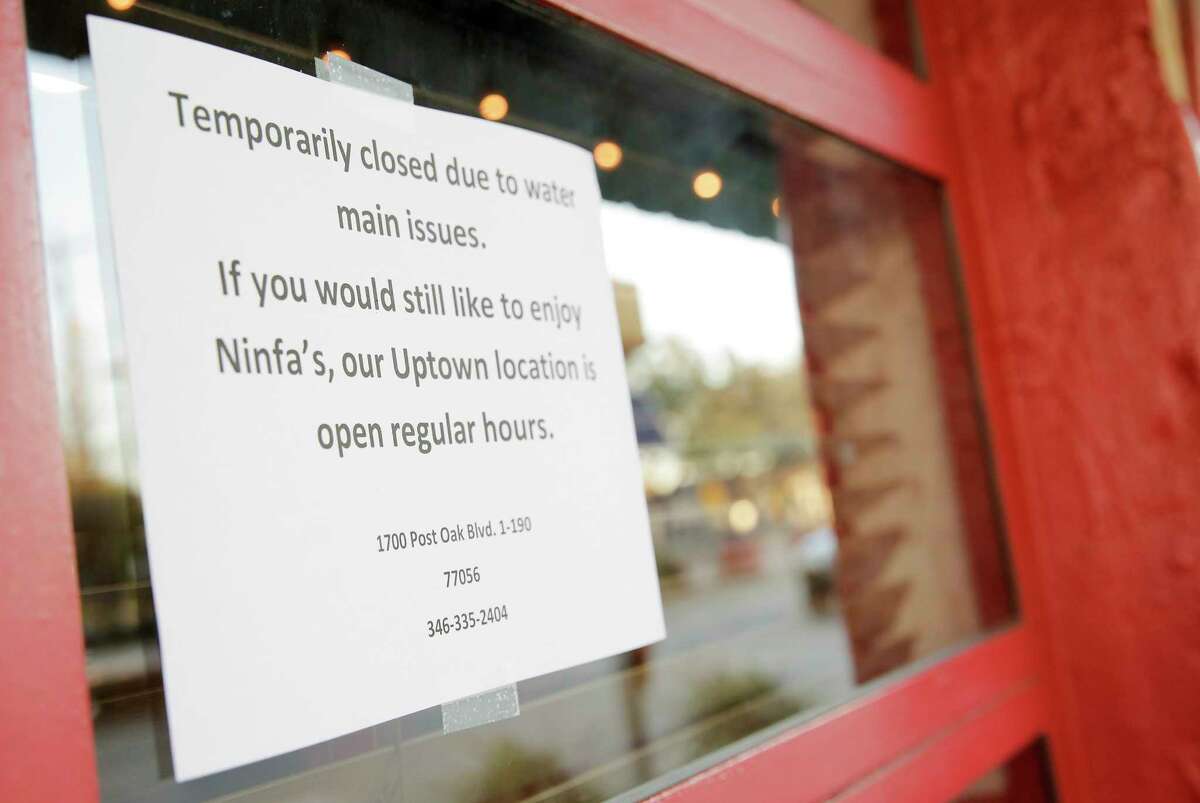 A sign on the door of Ninfa's in Houston following the water main break on Thursday, Feb. 27, 2020.