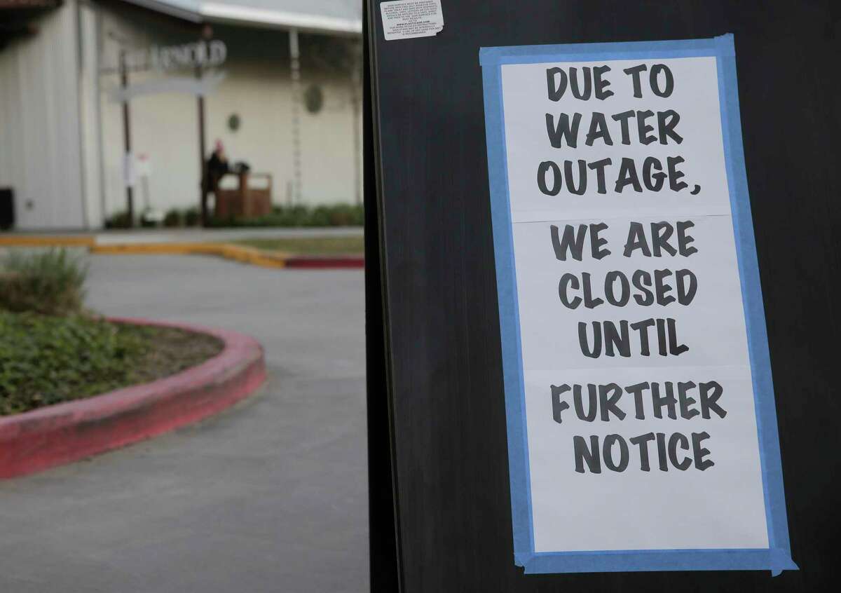 A sign on the outside the parking lot of St. Arnold's Brewery in Houston following the city's water main break on Thursday, Feb. 27, 2020.
