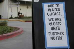 A sign on the outside the parking lot of St. Arnold's Brewery  in Houston following the city's water main break on Thursday, Feb. 27, 2020.