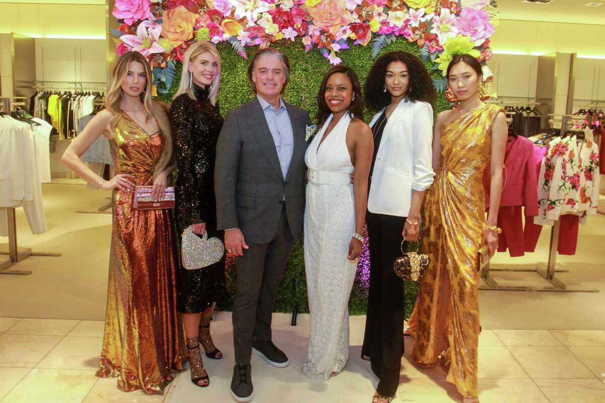 General manager Stephen Brunelle and the Chronicle’s Amber Elliott, center, with models at the Neiman Marcus spring trends cocktail party on February 12, 2020 at Neiman Marcus in Houston.