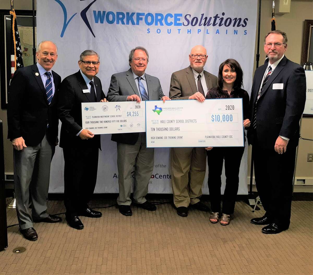 Officials with Plainview ISD and the Plainview Hale County Economic Development Corporation accept checks for Plainview ISD’s CTE programs from Workforce Solutions South Plains. Pictured (L-R): Lubbock Mayor Dan Pope, WSSP CEO Martin Aguirre, WSSP Board Chairman Chuck Smith, Plainview-Hale County EDC Executive Director Mike Fox, PISD director of secondary teaching and learning Robin Straley, and Brant Reagan, Plainview High School principal