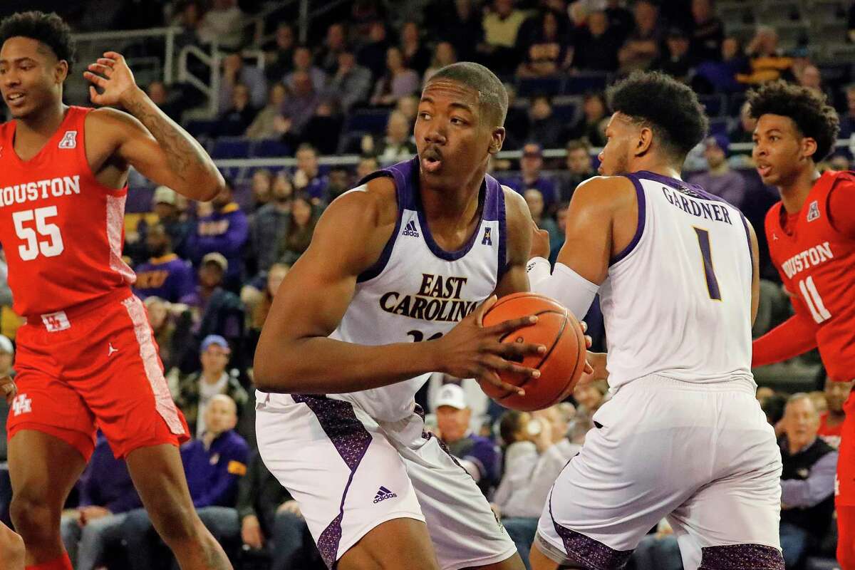 East Carolina's Charles Coleman (32) grabs a rebound against Houston during the second half of an NCAA college basketball game in Greenville, N.C., Wednesday, Jan. 29, 2020. (AP Photo/Karl B DeBlaker)