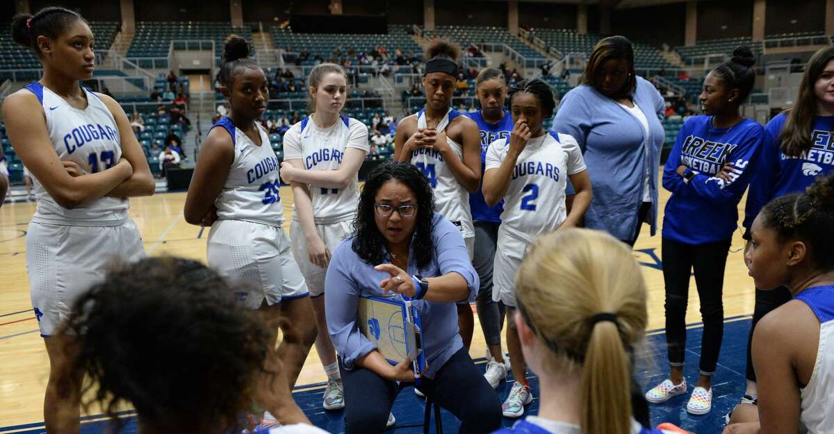Cy Creek Head Coach Jennifer Alexander talks to her team during a time out late in the fourth quarter of a Girls 6A Region III semifinal play-off game between the Cy Creek Cougars and the Summer Creek Bulldogs on Friday, February 28, 2020 at the Leonard Merrell Center, Katy, TX.