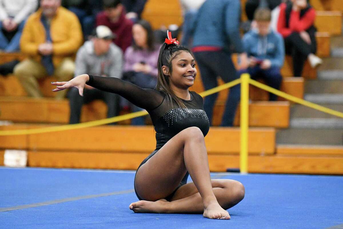 Conard’s Taylor Nicholson-Gauvin performs the Floor Exercise during the CIAC Class M Gymnastics Championship at Jonathan Law, Saturday, February 29, 2020,