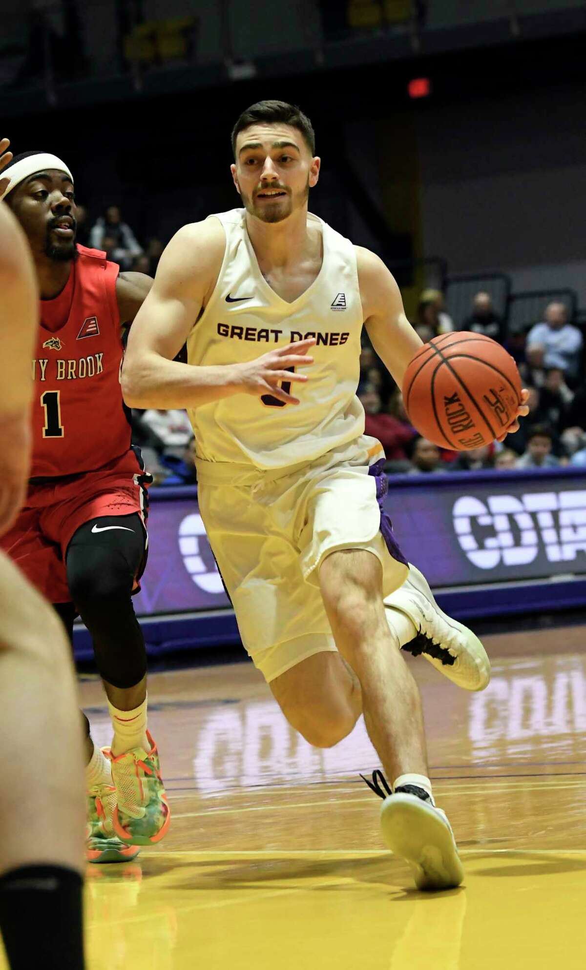 Stony Brook guard Makale Foreman (1) defends against University at Albany guard Antonio Rizzuto (0) during the first half of a NCAA college basketball game, Saturday, Feb. 29, 2020, in Albany, N.Y. (Hans Pennink / Special to the Times Union)