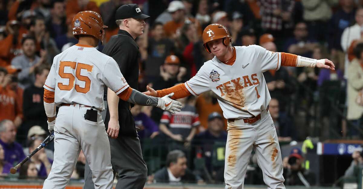 PHOTOS: Baylor vs. LSU Texas third baseman Cam Williams (55) welcomes home second baseman Brenden Dixon (1) during the fourth inning of the Shriners Hospitals for Children College Classic at Minute Maid Park on Friday, Feb. 28, 2020, in Houston.