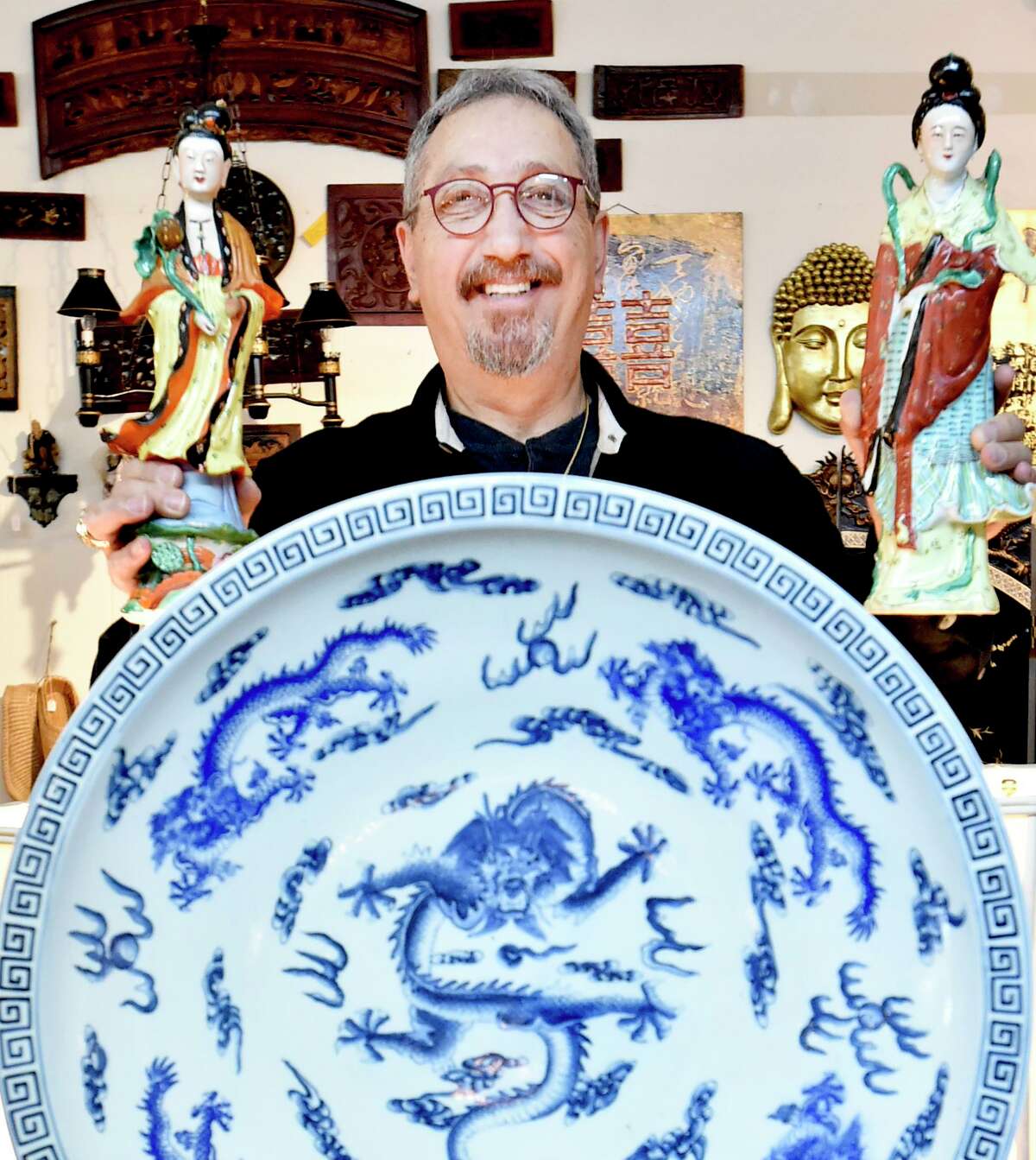 Above, Akil Tanriguden loves Asian history and culture that is inclined to keep very strong traditions alive. His antique shop is organized into the following categories: Shoreline-American; Morrocan-Turkish-Anatolian, Asian, European-Italian, and African with much room made for traditional artwork.
