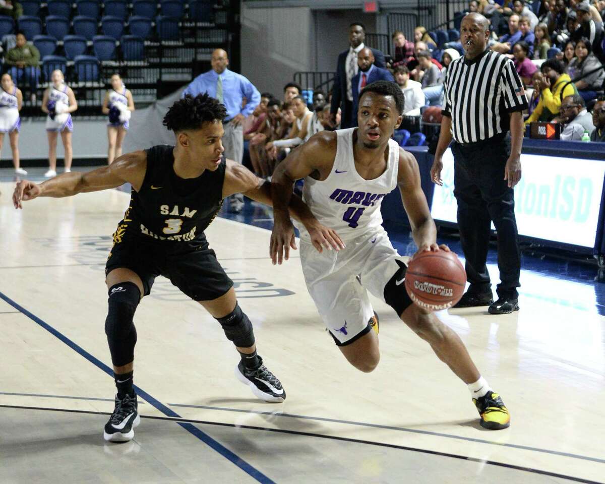 LJ Cryer (4) of Morton Ranch drives around Jerrick Baines (3) of Sam Houston during the second quarter of the Boys 6A Region III Area play-off game between the Morton Ranch Mavericks and the Sam Houston Tigers on Thursday, February 27, 2020 at Delmar Fieldhouse, Houston, TX.