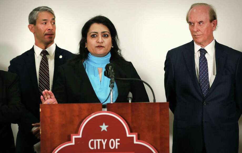 Mayor Ron Nirenberg, left, and County Judge Nelson Wolff, right, listen to Anita Kurian, assistant director of San Antonio Metropolitan Health overseeing the communicable disease division, at a news conference on March 2 at Plaza de Armas during the early days of the novel coronavirus pandemic. Daily briefings with Nirenberg and Wolff have continued; Kurian is a frequent guest. The briefings can be seen live at 6:13 p.m. every day at www.facebook.com/cosagov Photo: Bob Owen /San Antonio Express-News / San Antonio Express-News