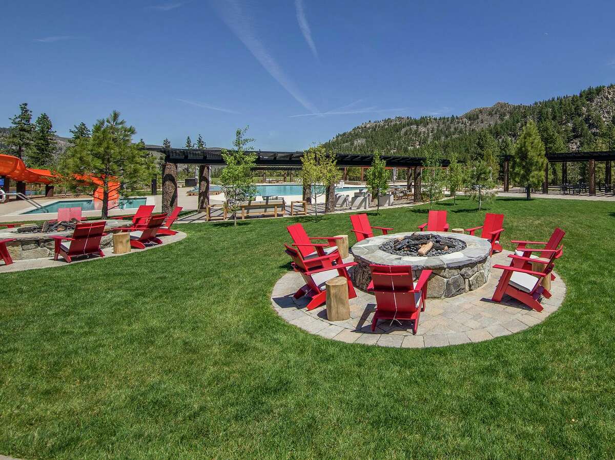 Multiple gas fire pits rest beside the pool and recreation area at the Summit Camp of Carson City’s exclusive Clear Creek Tahoe community.
