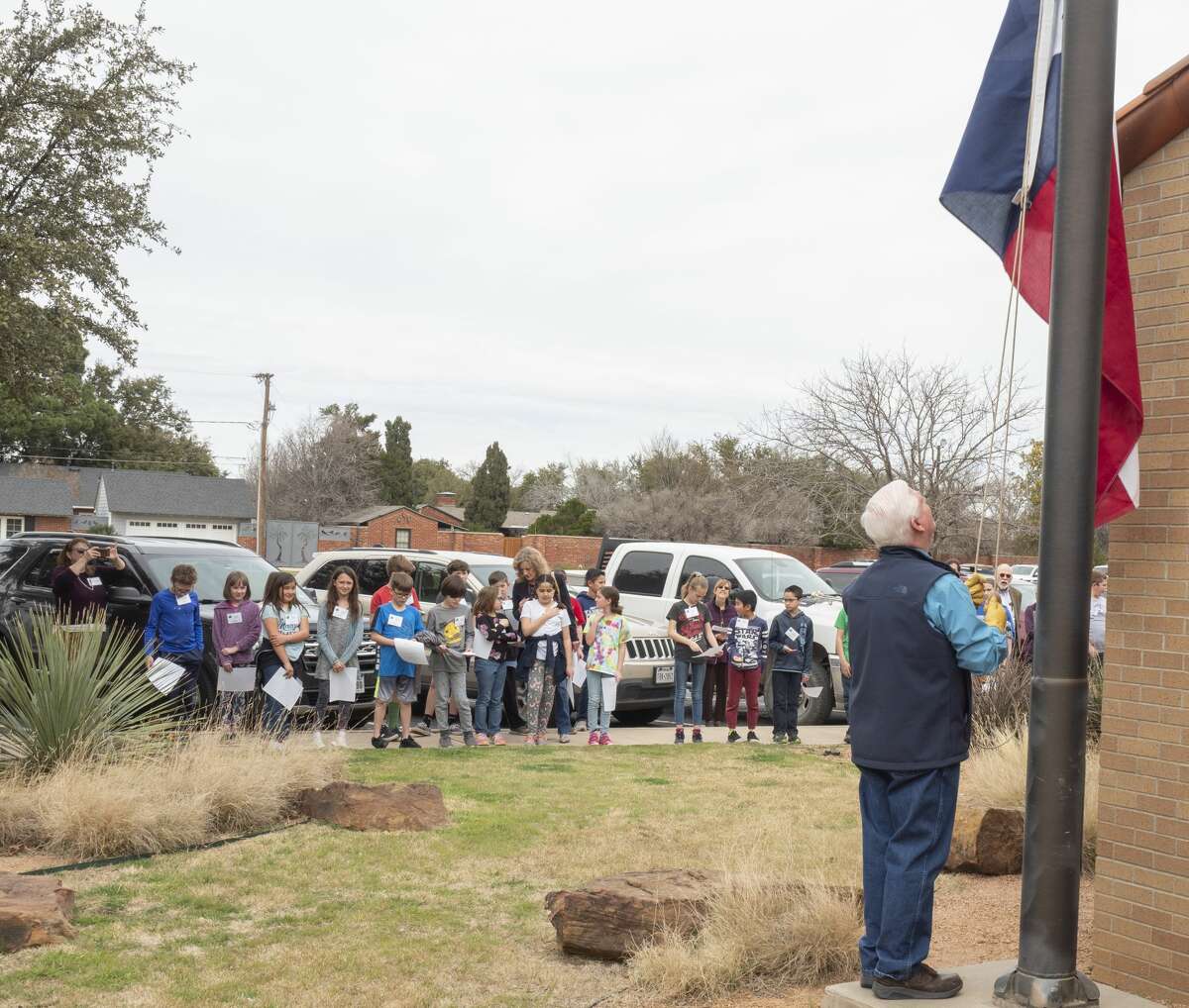 Pat McDaniel raises the Texas Flag 03/02/2020 outside the Haley Library during the Texas Independence Day celebration. Tim Fischer/Reporter-Telegram