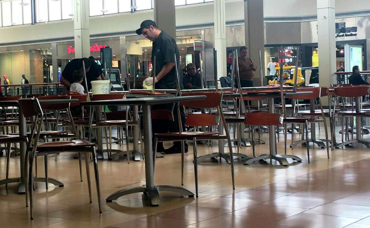 A North Star Mall employee cleans tables at the food court Monday morning. March 3, 2020. A person who tested positive for the coronavirus by state health officials visted the mall Saturday.
