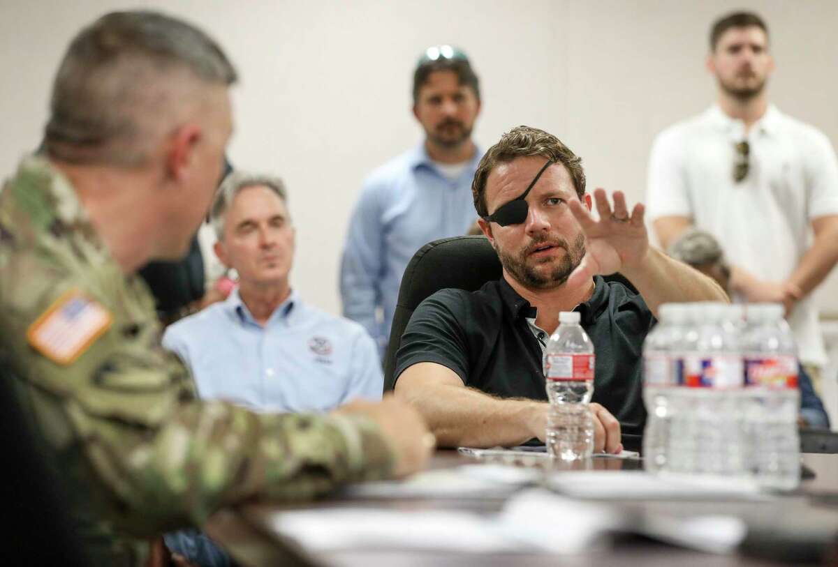 U.S. Rep. Dan Crenshaw asks questions during a briefing about the Addicks and Barker Reservoirs on Friday, Aug. 16, 2019, in Houston.