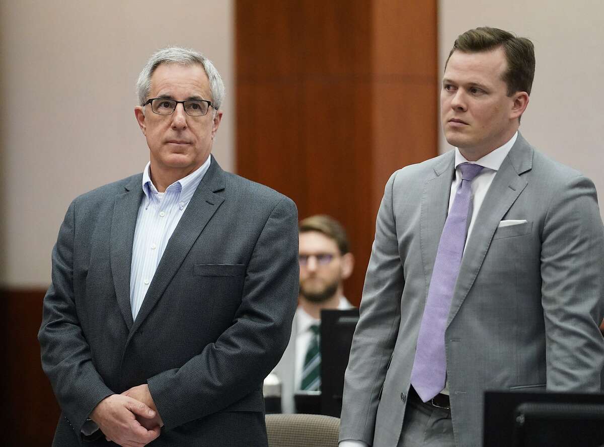 Michael Keough, retired vice president of Arkema Inc., left, and his defense attorney Cordt Akers, right, are shown during the Arkema Inc. criminal trial at Harris County Criminal Courthouse, Monday, March 2, 2020, in Houston. Arkema Inc., a subsidiary of a French chemical manufacturer, along with three senior staff members are on trial over a fire at the Crosby chemical plant that was overwhelmed by Hurricane Harvey's flooding in 2017.